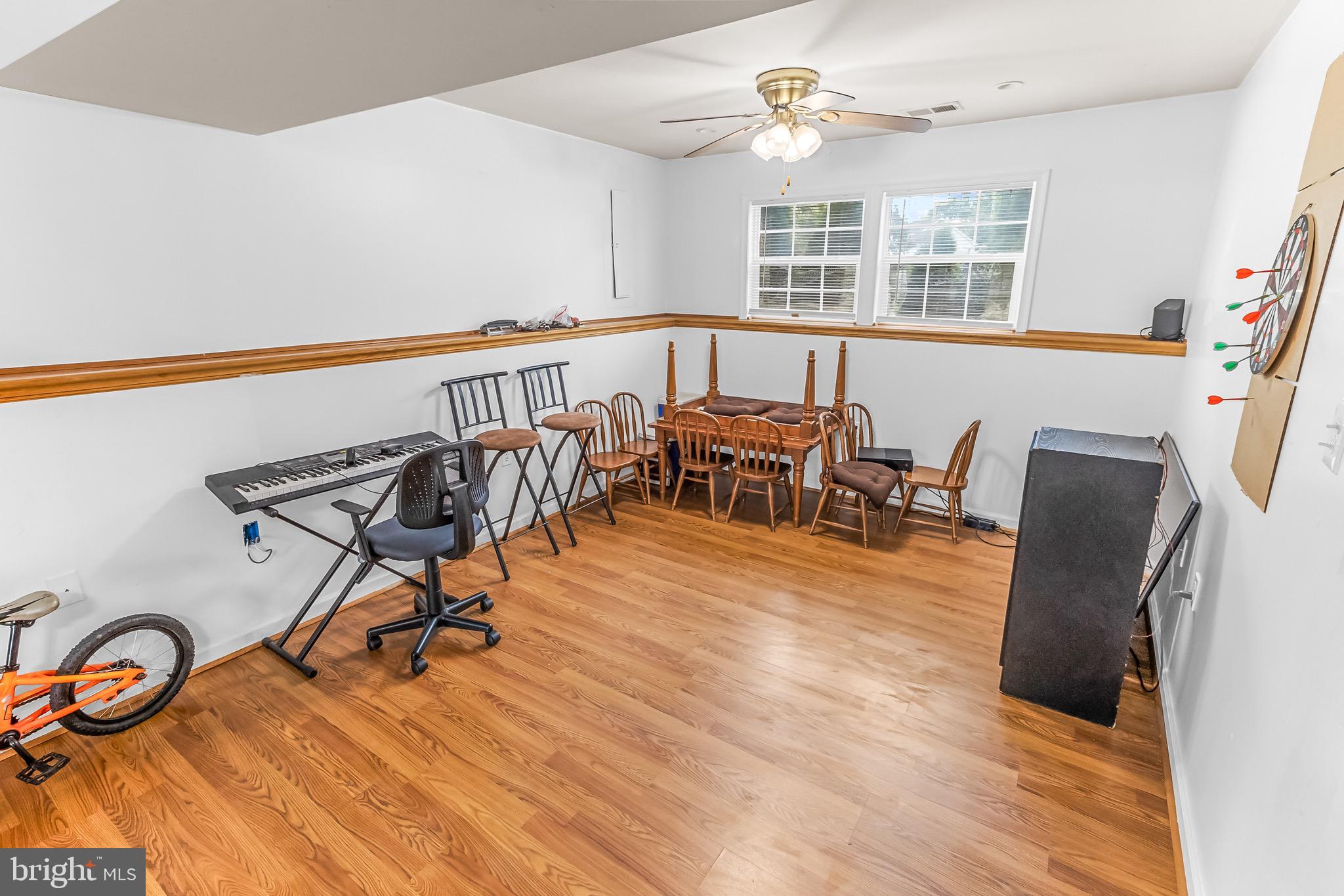 207 Preston Place Ranson, WV 25438 - Photo 21 of 32 a view of a dining room with furniture window and wooden floor