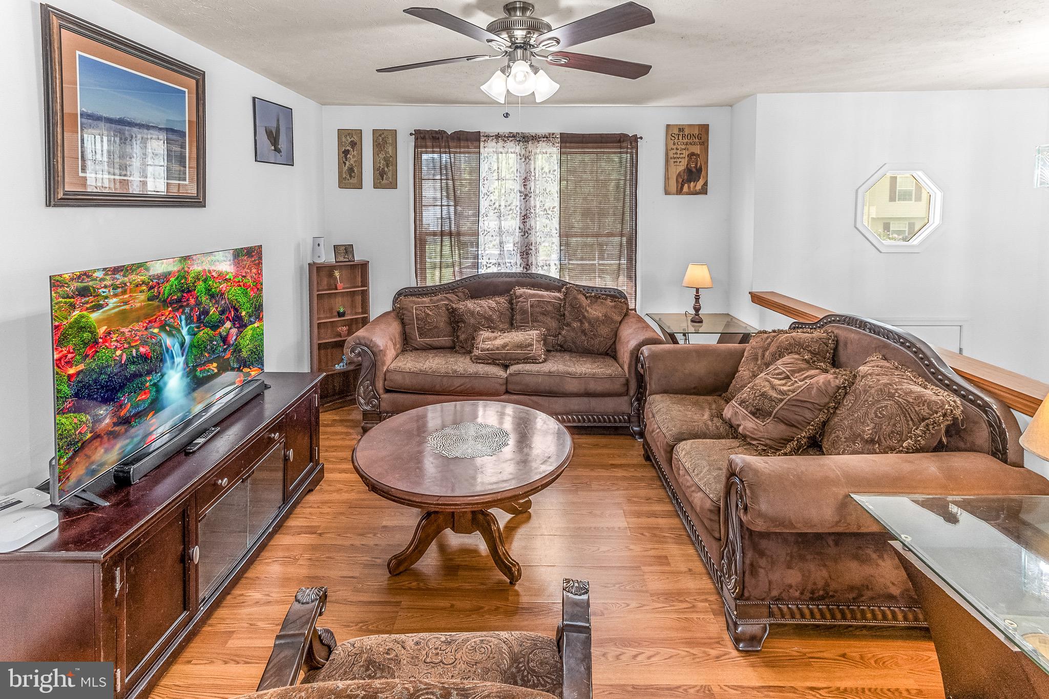 207 Preston Place Ranson, WV 25438 - Photo 6 of 32 a living room with furniture and a flat screen tv