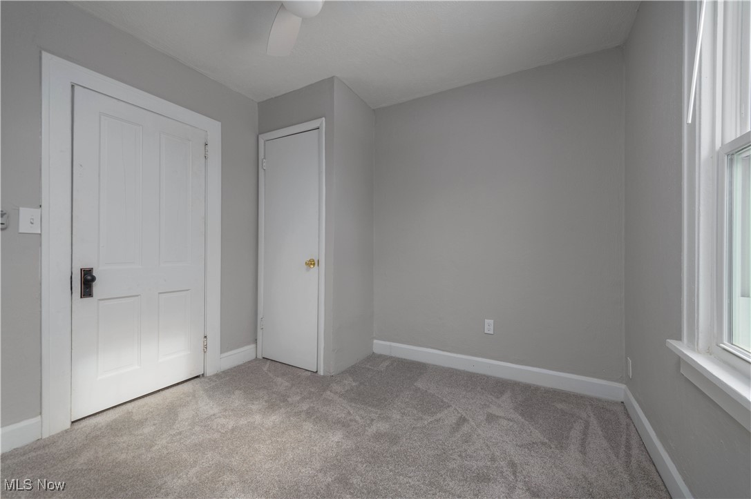 218 Roxboro Road Vermilion, OH 44089 - Photo 24 of 50 Unfurnished bedroom with light colored carpet and a ceiling fan