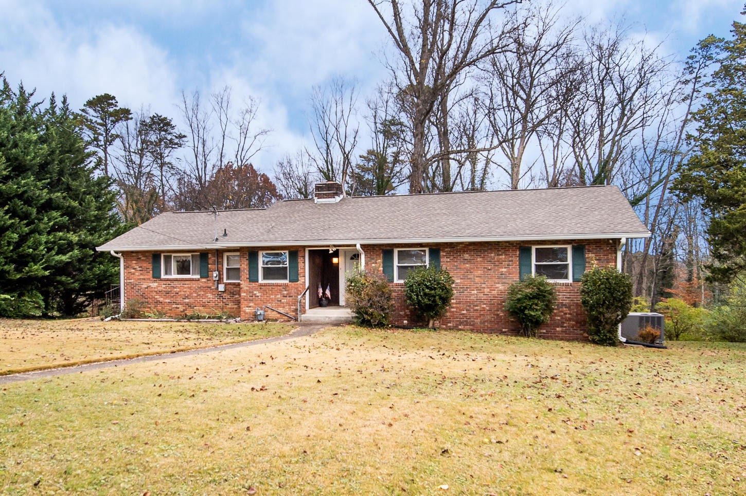 122 Euclid Circle Oak Ridge, TN 37830 - Photo 1 of 20 a front view of a house with a yard covered in snow