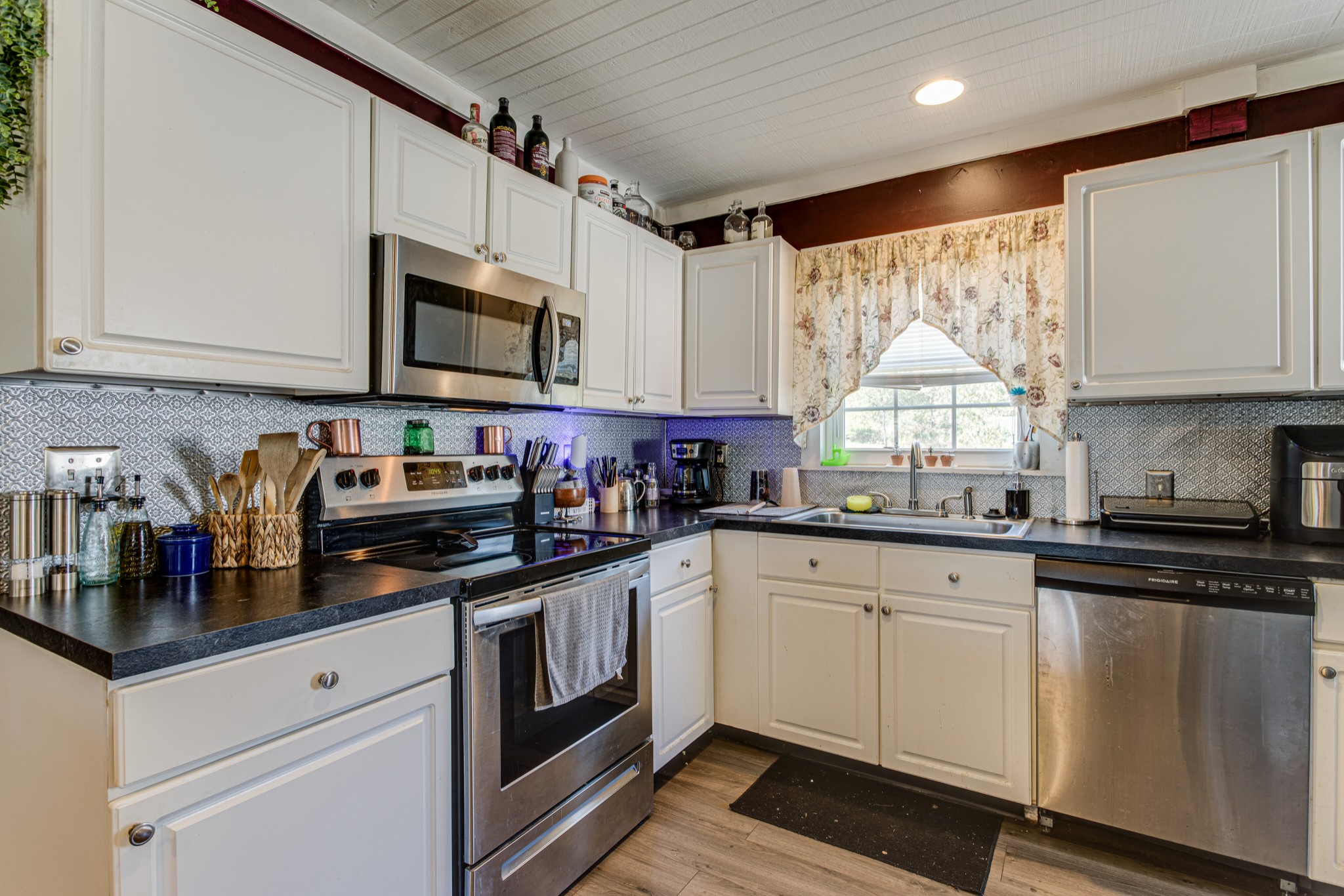 1394 Harpo Road Manchester, TN 37355 - Photo 12 of 32 a kitchen with stainless steel appliances granite countertop a sink and cabinets