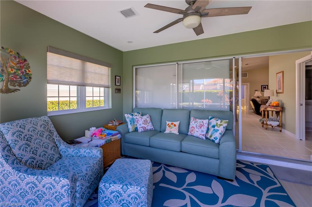 4167 St George Lane Naples, FL 34119 - Photo 7 of 14 a living room with furniture and a window