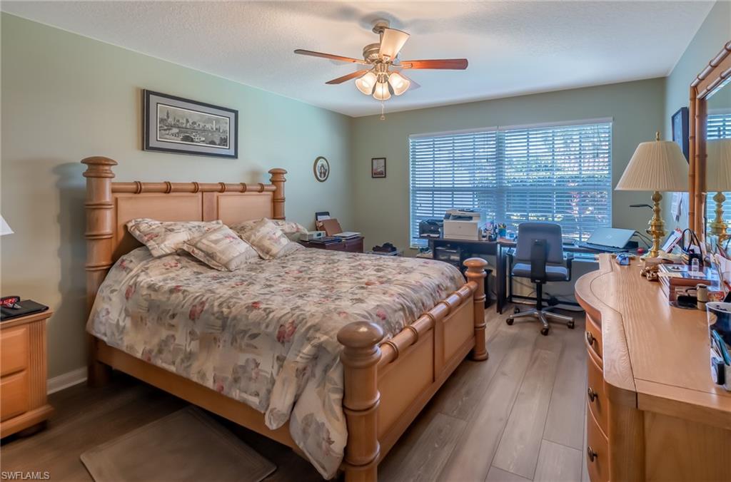4167 St George Lane Naples, FL 34119 - Photo 8 of 14 a bed room with a bed and a window