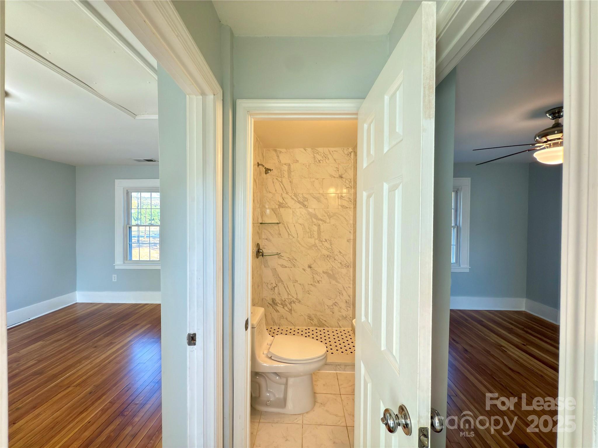 130 Maple Street Badin, NC 28009 - Photo 15 of 24 a bathroom with a toilet and a shower