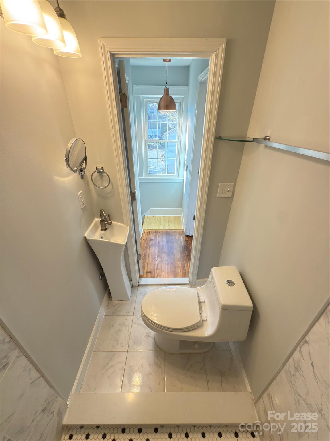 130 Maple Street Badin, NC 28009 - Photo 17 of 24 a bathroom with a toilet and a shower