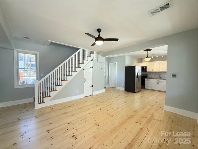a view of an entryway with wooden floor