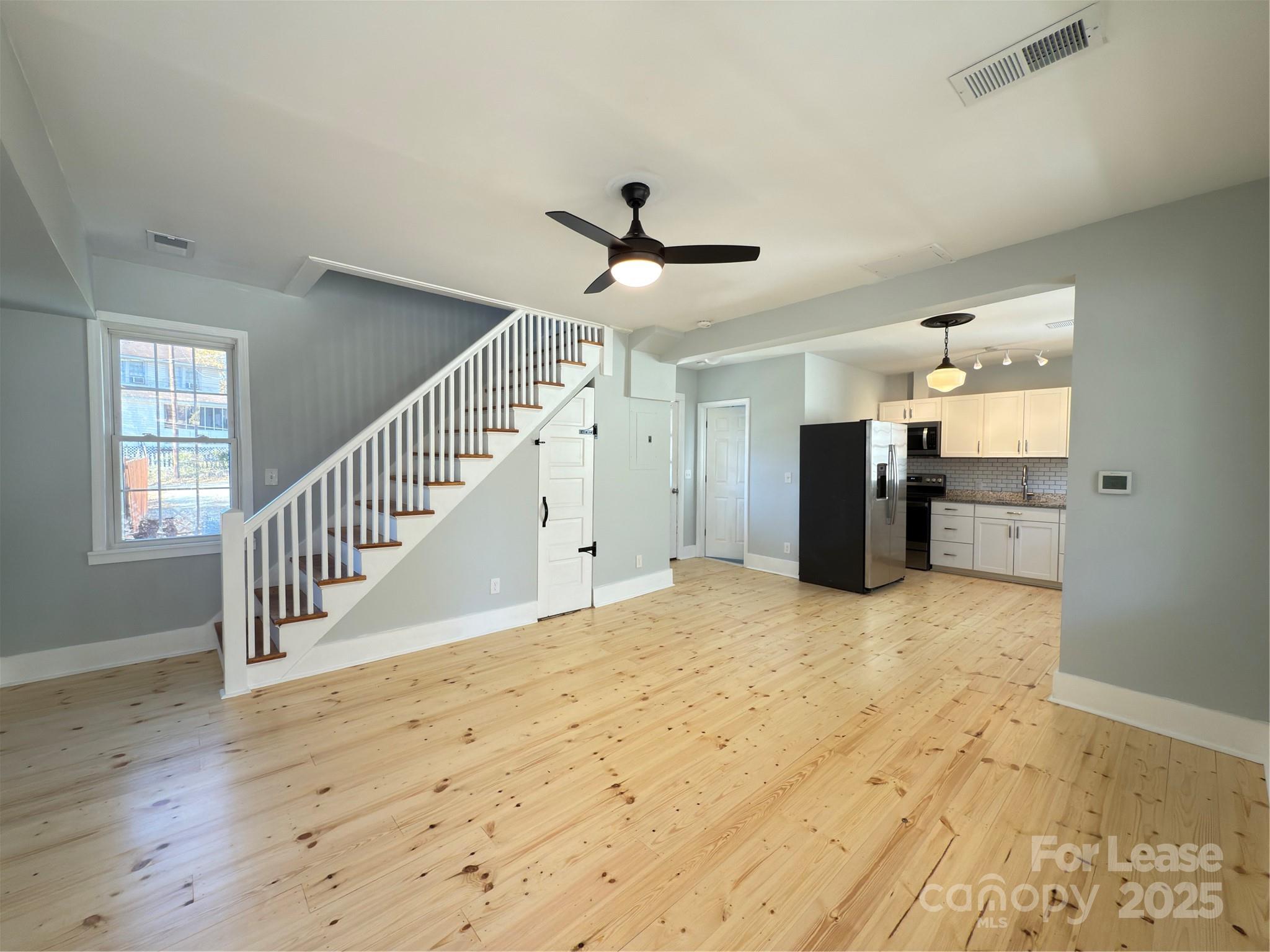 130 Maple Street Badin, NC 28009 - Photo 6 of 24 a view of an entryway with wooden floor