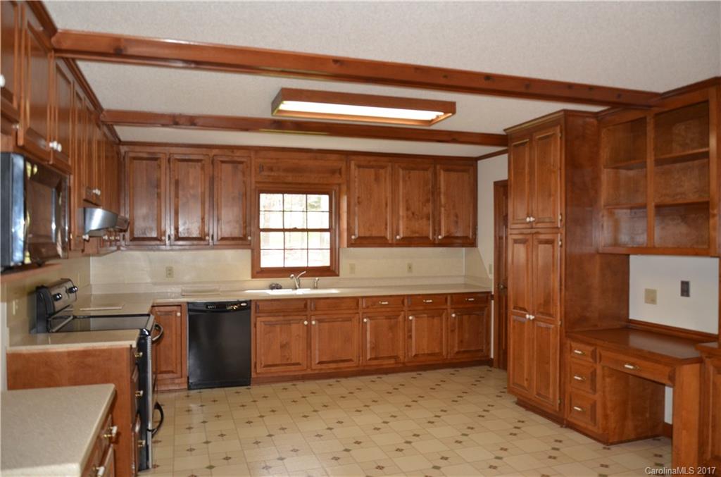 245 Gregory Road Salisbury, NC 28147 - Photo 7 of 16 a kitchen with stainless steel appliances granite countertop a sink and cabinets
