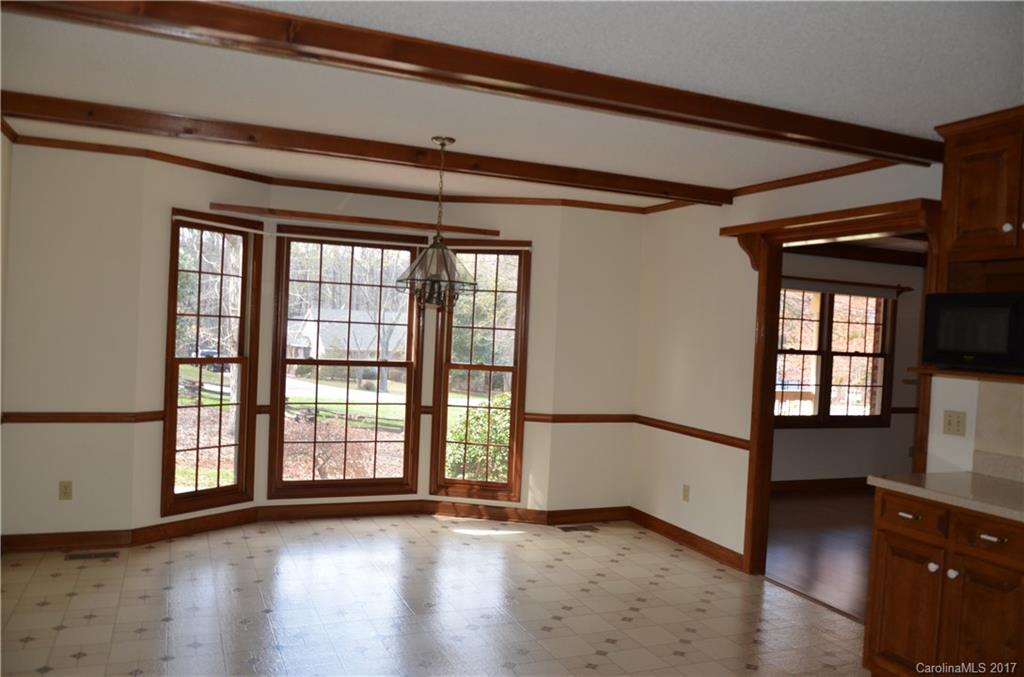 245 Gregory Road Salisbury, NC 28147 - Photo 8 of 16 a view of an empty room with wooden floor and a window