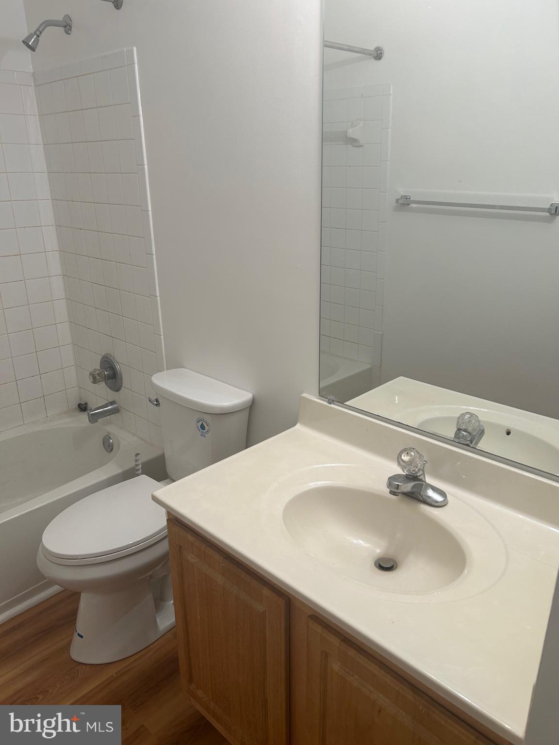 10109 Tulip Tree Drive Bowie, MD 20721 - Photo 5 of 8 a bathroom with a sink toilet and a mirror