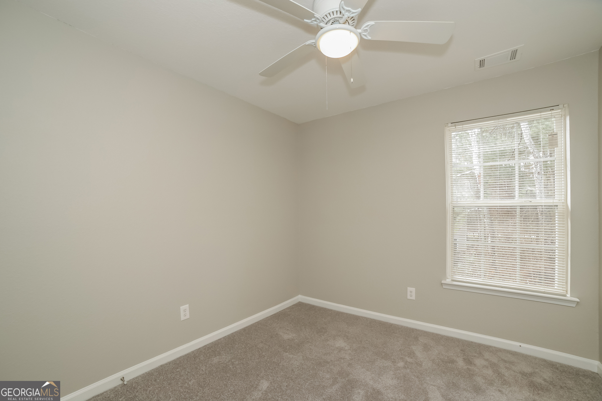 7111 Brookview Way Riverdale, GA 30274 - Photo 11 of 17 an empty room with a window