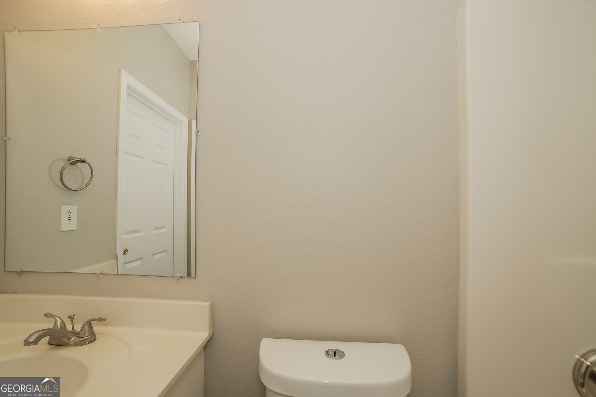 7111 Brookview Way Riverdale, GA 30274 - Photo 15 of 17 a bathroom with a sink and a mirror