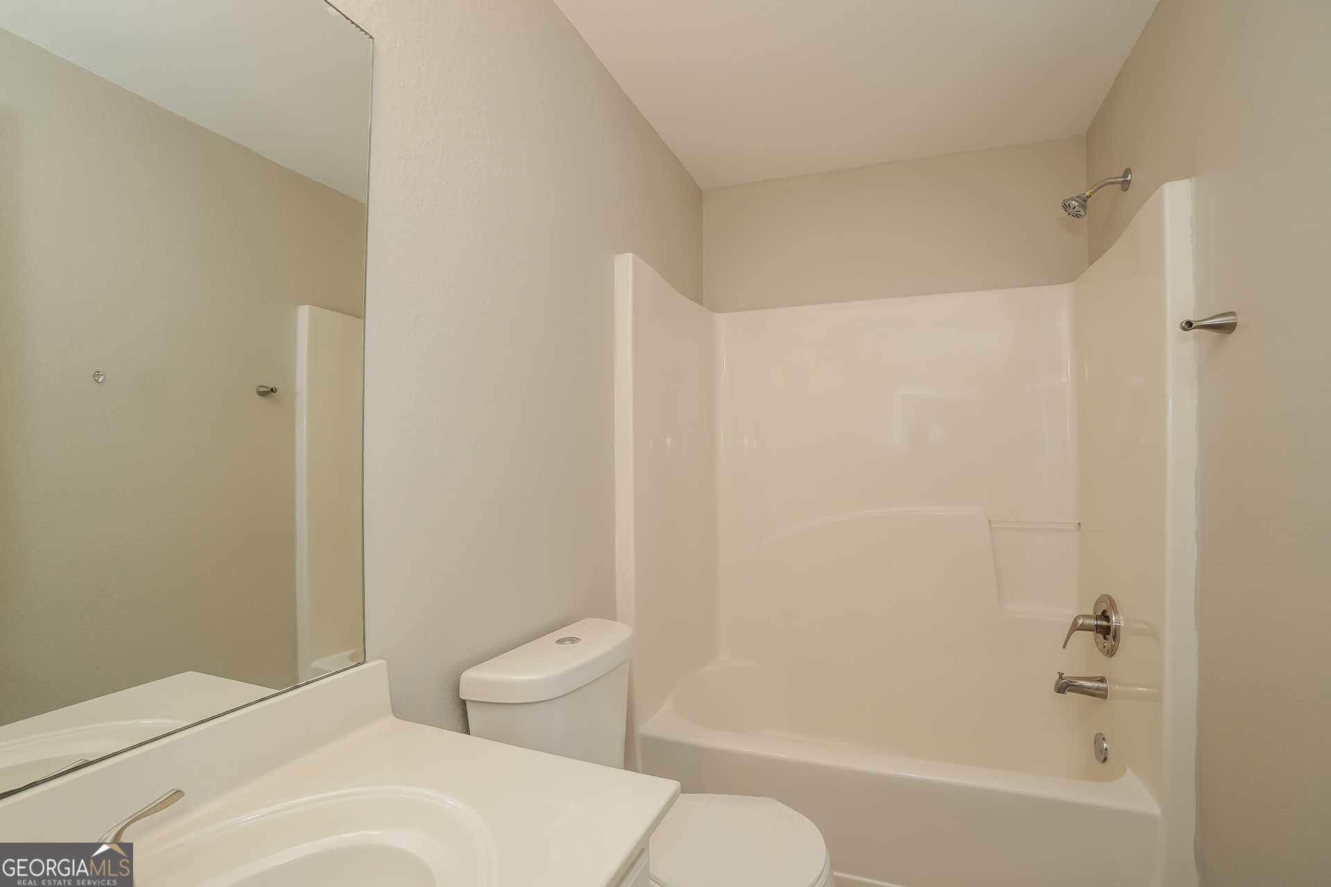 7111 Brookview Way Riverdale, GA 30274 - Photo 16 of 17 a bathroom with a toilet and a bathtub