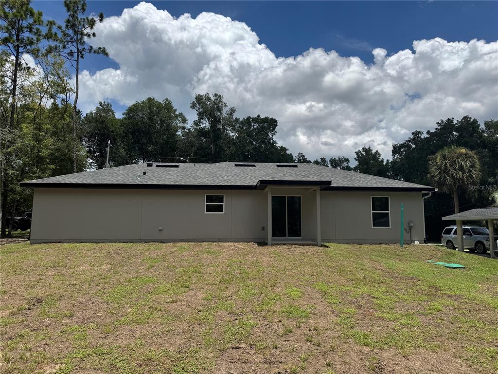 3244 East Deal Street Inverness, FL 34453 - Photo 17 of 17 a view of a house with a yard