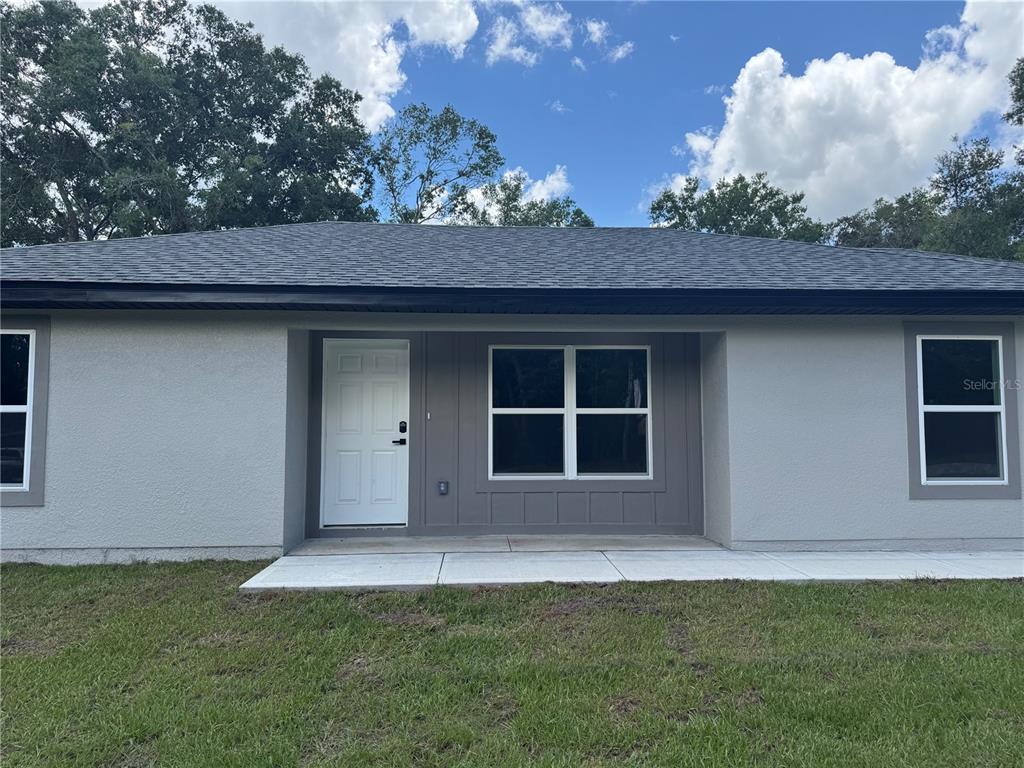 3244 East Deal Street Inverness, FL 34453 - Photo 2 of 17 a house view with a garden space