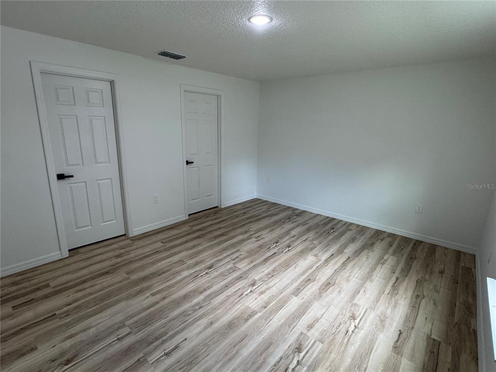 3244 East Deal Street Inverness, FL 34453 - Photo 5 of 17 a view of empty room with wooden floor