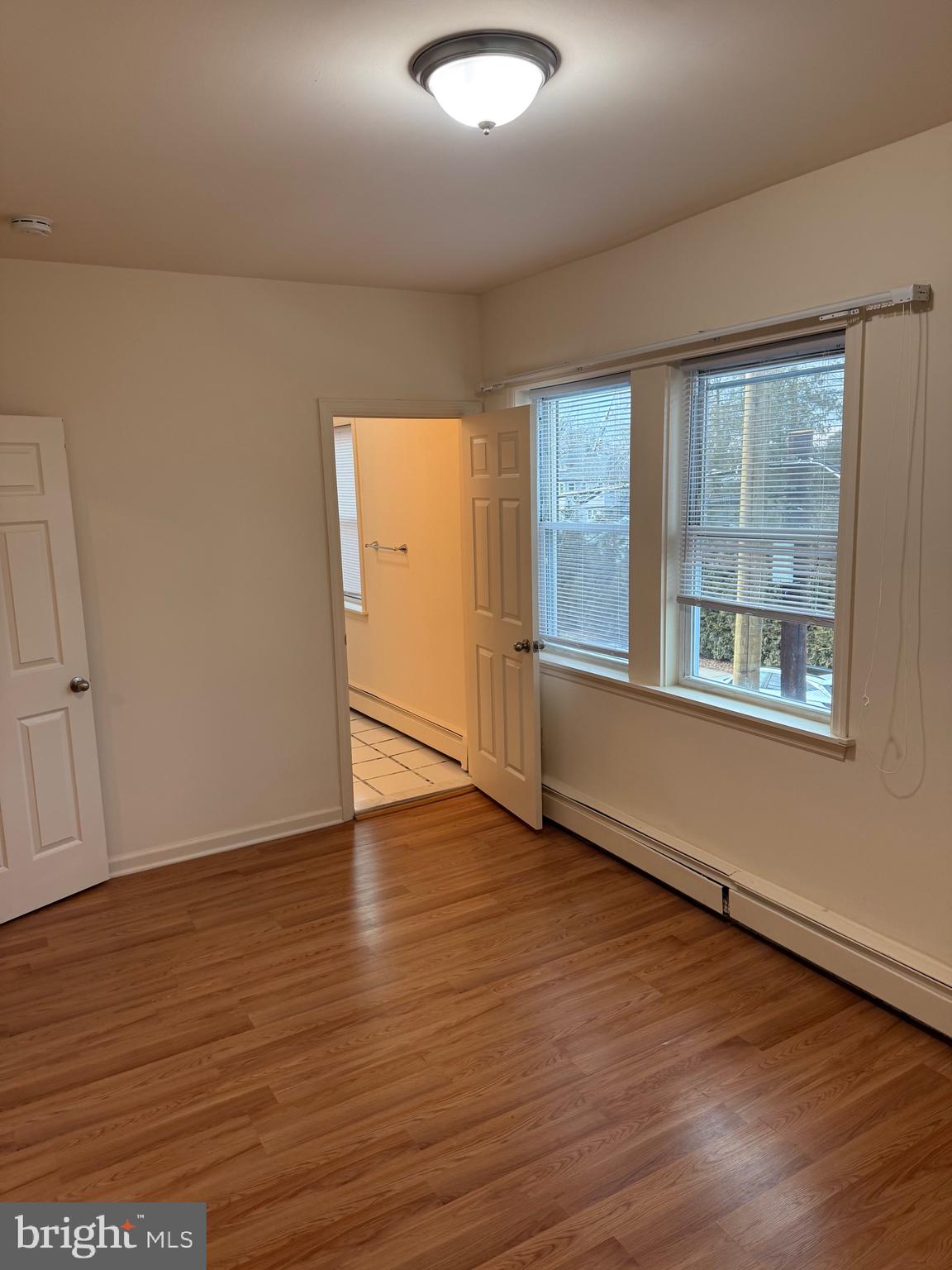 400 Richey Avenue Oaklyn, NJ 08107 - Photo 11 of 14 an empty room with wooden floor and windows