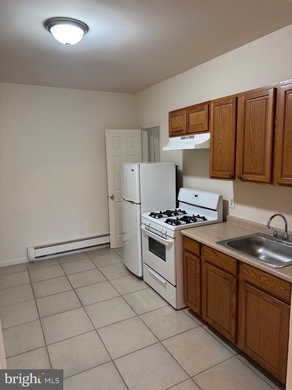 400 Richey Avenue Oaklyn, NJ 08107 - Photo 3 of 14 a kitchen with stainless steel appliances granite countertop a stove a sink and a refrigerator
