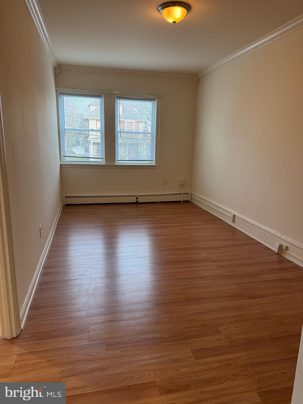 400 Richey Avenue Oaklyn, NJ 08107 - Photo 6 of 14 an empty room with wooden floor and windows