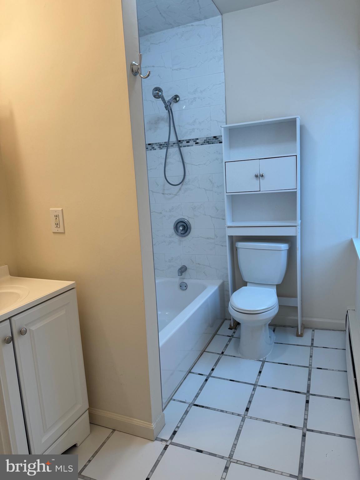 400 Richey Avenue Oaklyn, NJ 08107 - Photo 8 of 14 a bathroom with a granite countertop toilet a sink and bathtub