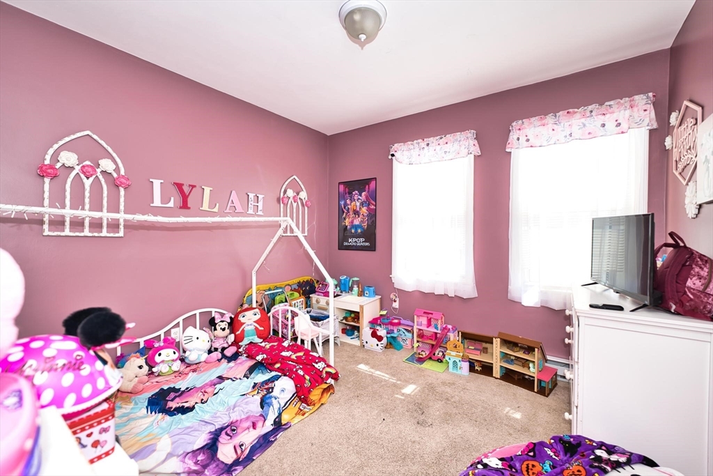 232 Alden Street Fall River, MA 02723 - Photo 21 of 34 a bedroom with furniture and a baby crib