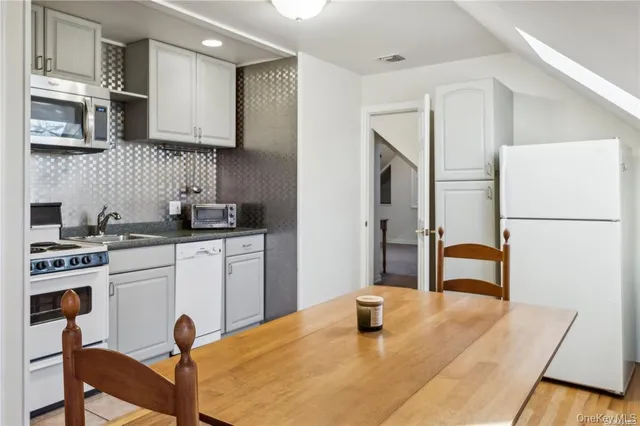 a view of a hallway with seating area