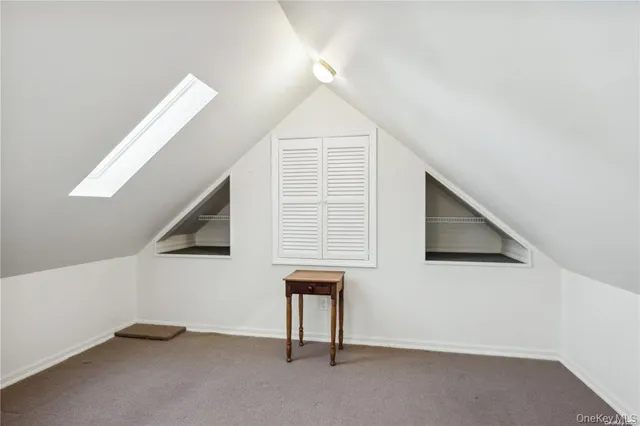 a bathroom with a sink a mirror and a shower