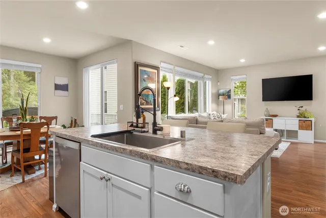 a kitchen with granite countertop a sink and a counter top space