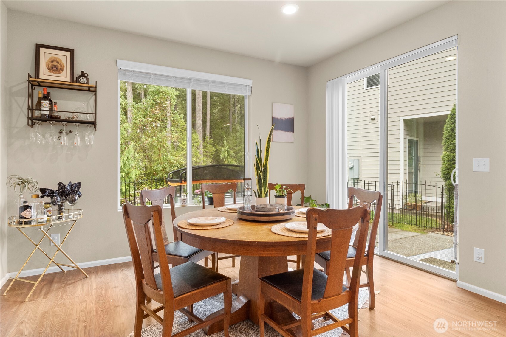 3923 Jett Lane Lacey, WA 98516 - Photo 14 of 40 a view of a dining room with furniture large windows and wooden floor