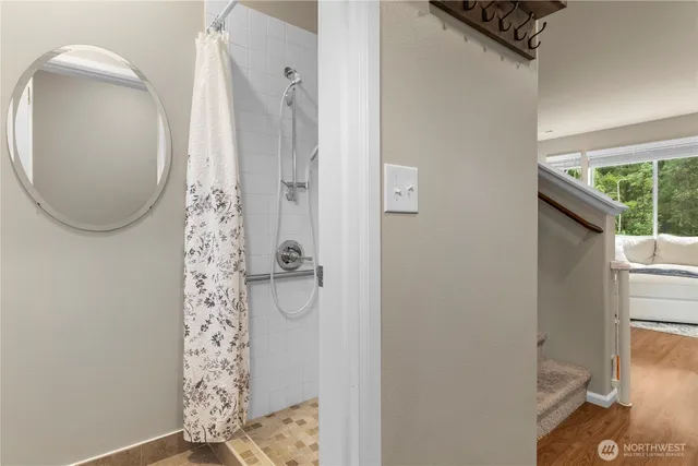 view of small space with wooden floor and entryway