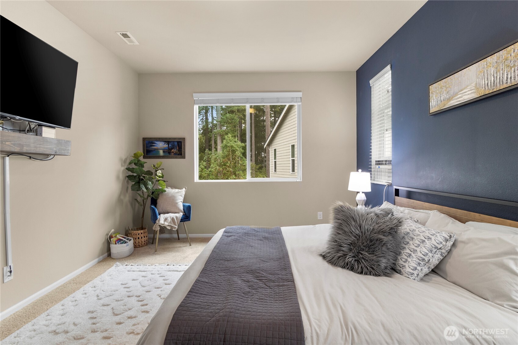 3923 Jett Lane Lacey, WA 98516 - Photo 18 of 40 a bed room with a bed a television and a window