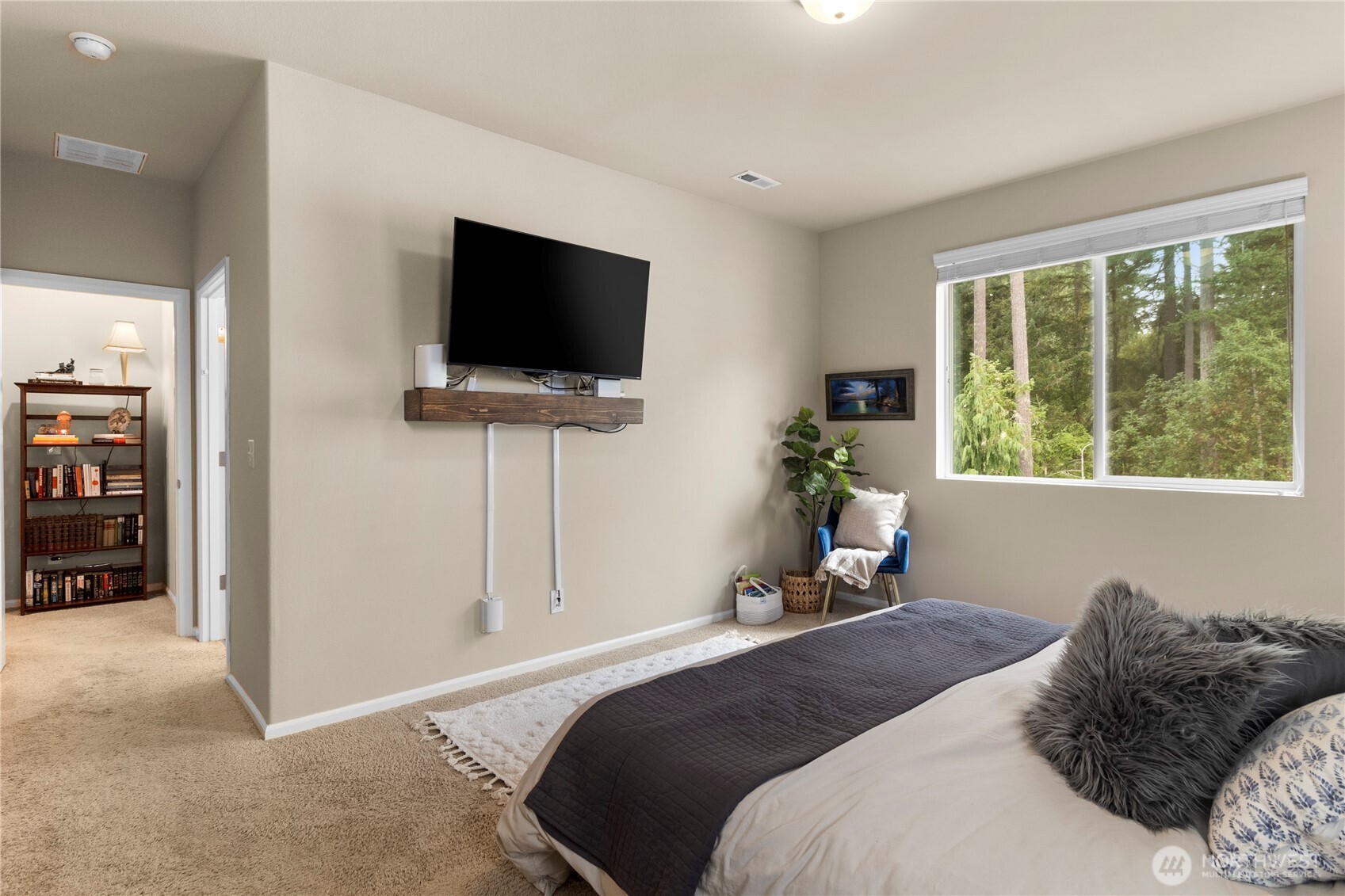 3923 Jett Lane Lacey, WA 98516 - Photo 19 of 40 a bedroom with a bed and a flat screen tv