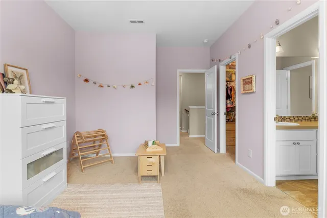 a view of bedroom with furniture and wooden floor