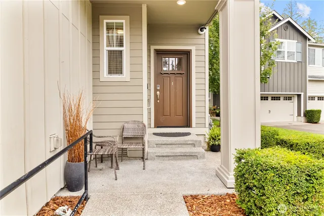 a view of porch with chairs and entryway