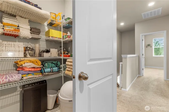 a kitchen with stainless steel appliances granite countertop a sink and wooden cabinets