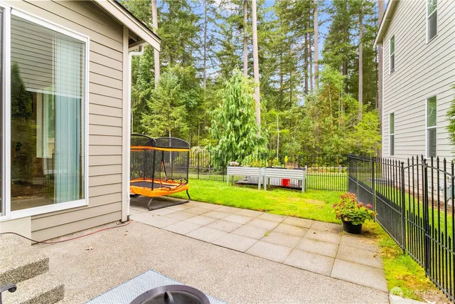 a view of a swimming pool with an outdoor seating