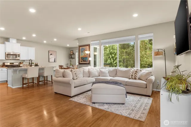 a living room with furniture and a large window