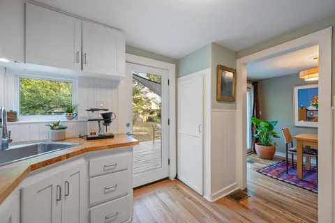 a kitchen with stainless steel appliances sink refrigerator and window