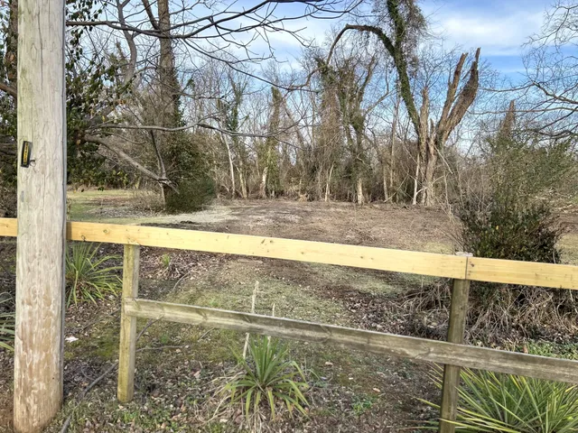 a view of a backyard of the house