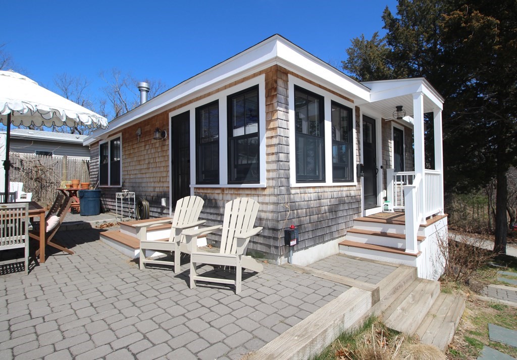 26 Delewanda Road Hull, MA 02045 - Photo 8 of 10 a front view of a house with outdoor seating