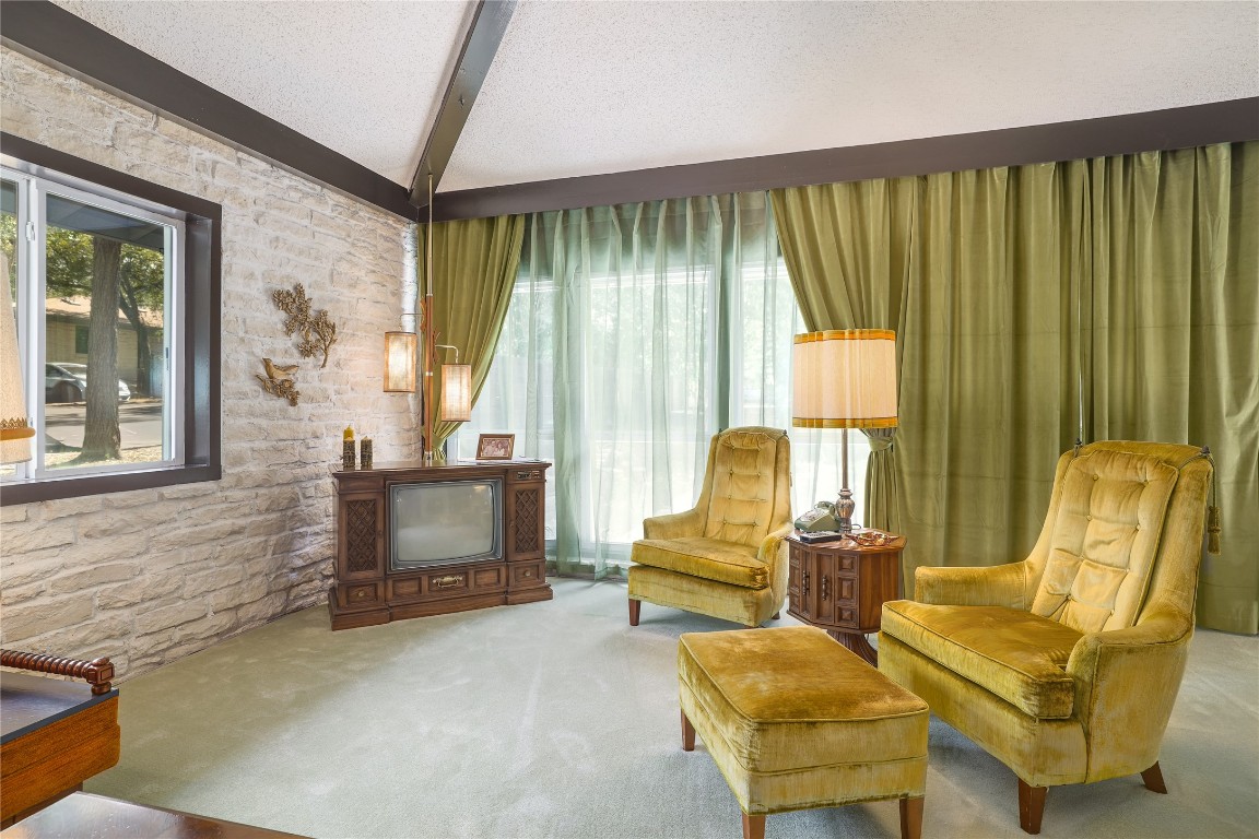 1818 Vance Circle Austin, TX 78701 - Photo 13 of 40 a living room with furniture and a fireplace