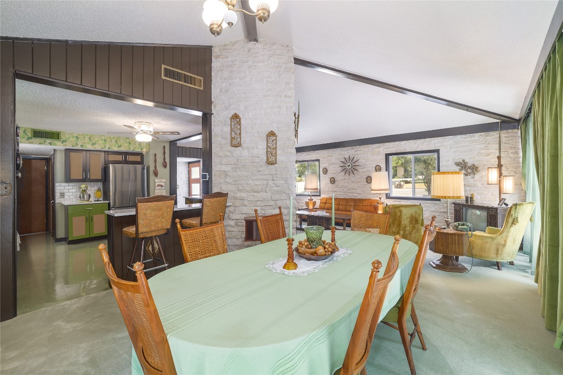 1818 Vance Circle Austin, TX 78701 - Photo 16 of 40 a dining room with furniture and wooden floor
