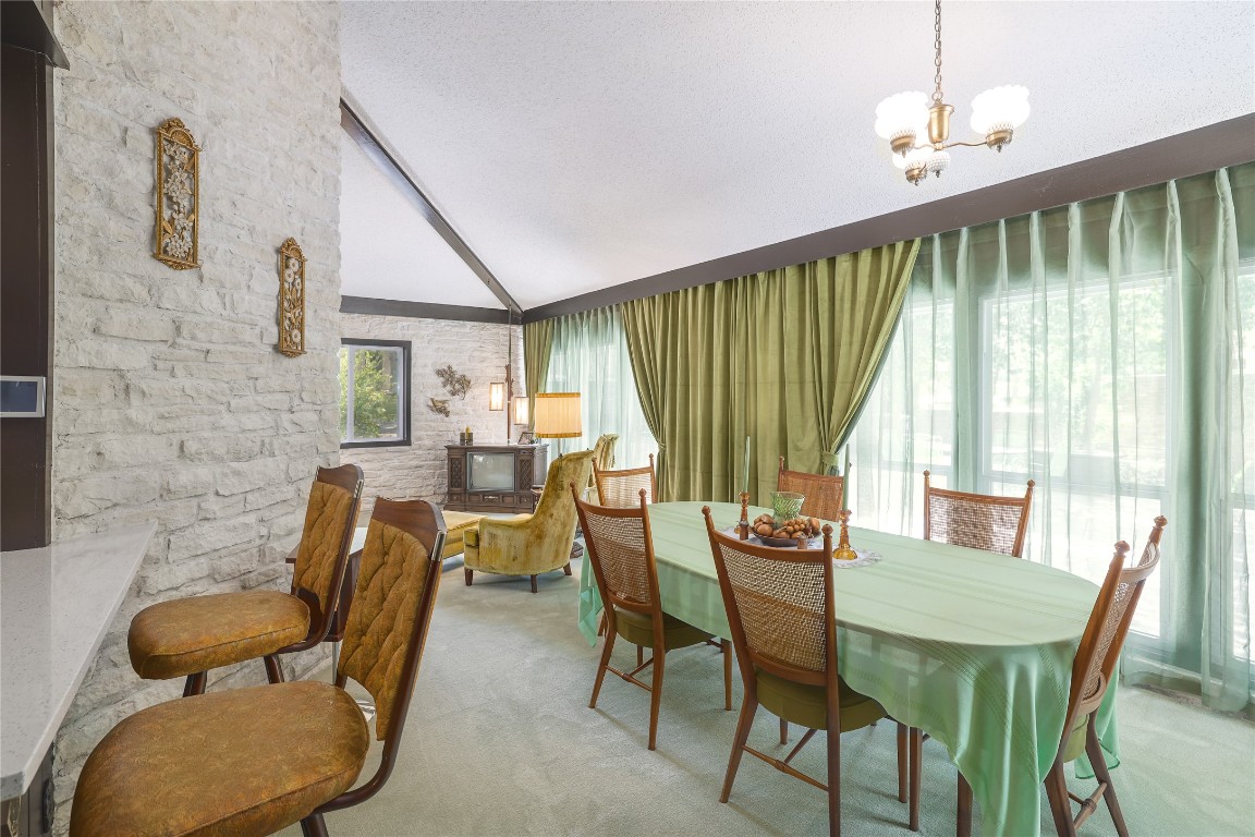 1818 Vance Circle Austin, TX 78701 - Photo 17 of 40 a dining room with furniture and window