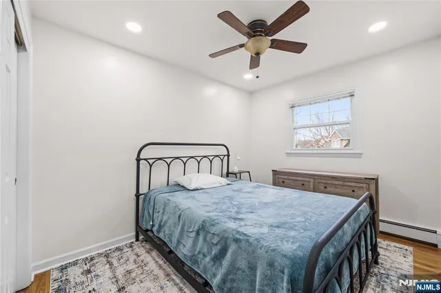 a bedroom with a bed and a table in it