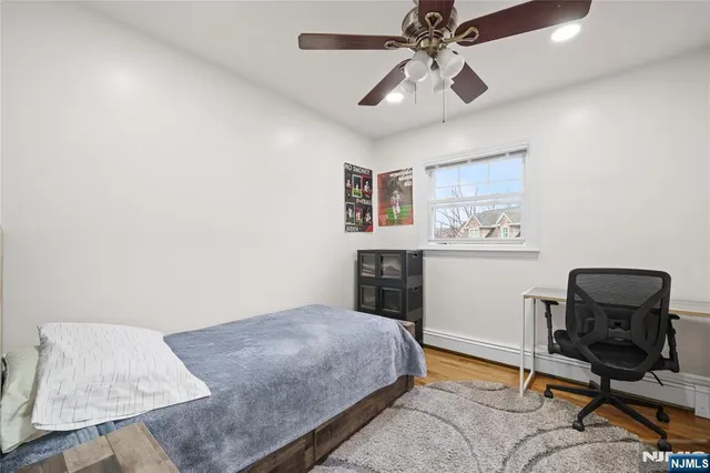 a bedroom with a workspace