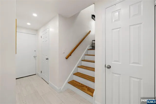 a view of entryway with stairs and wooden floor