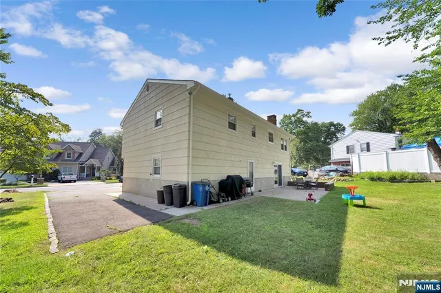 a view of a backyard with sitting area