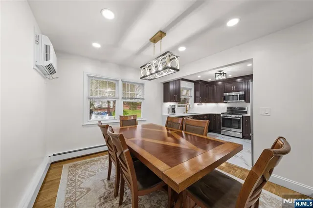 a dining room with furniture and window