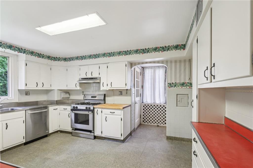 634 West Waldheim Road Pittsburgh, PA 15215 - Photo 16 of 50 a kitchen with white cabinets and white appliances