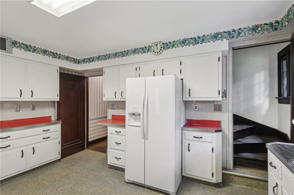 634 West Waldheim Road Pittsburgh, PA 15215 - Photo 19 of 50 a storage room with cabinets and wooden furniture